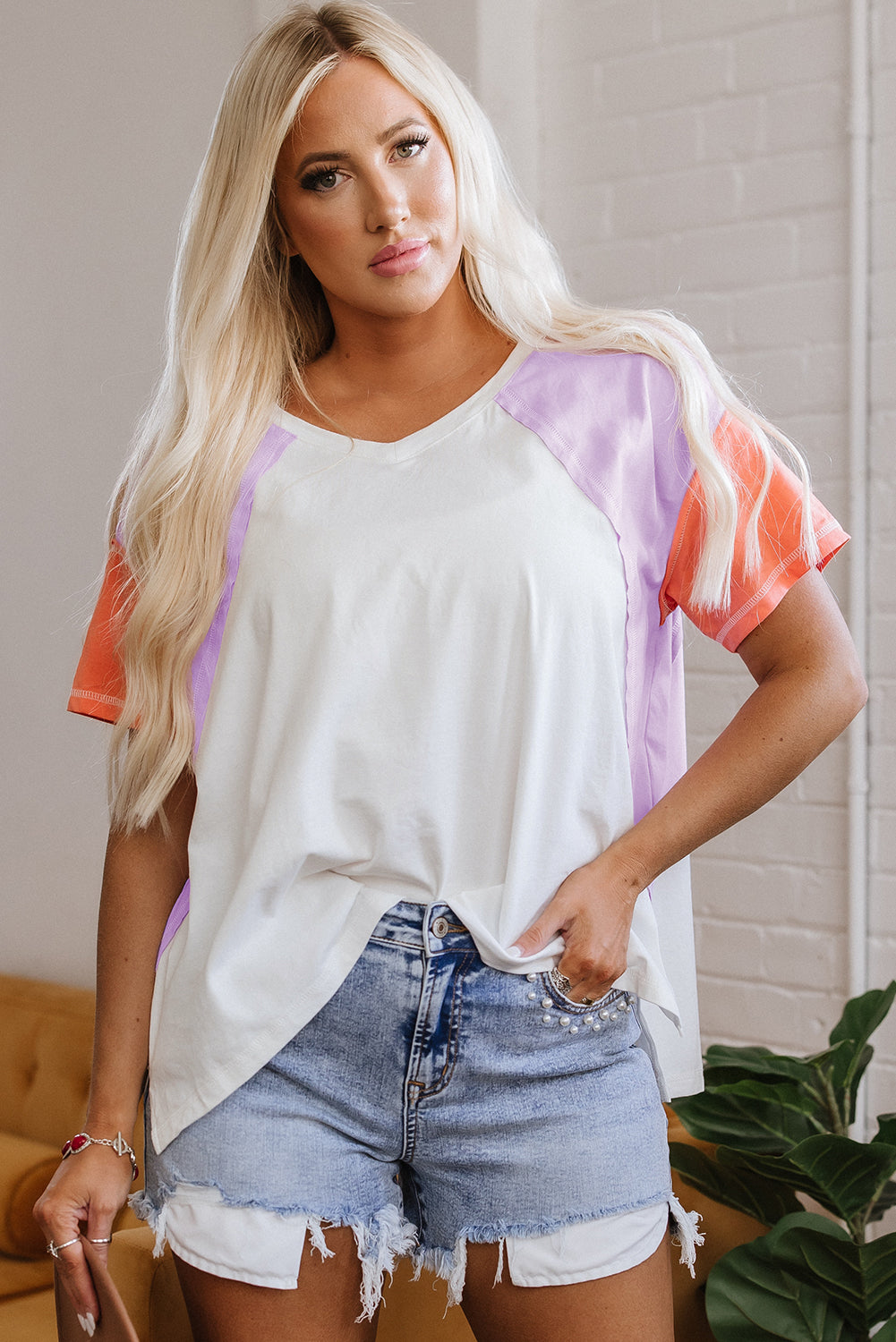 Rosalee V Neck Exposed Seam High Low Top